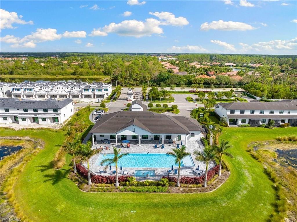 7622 Rockefeller Drive Naples, FL 34119 - Photo 36 of 40 a view of a city with lawn chairs