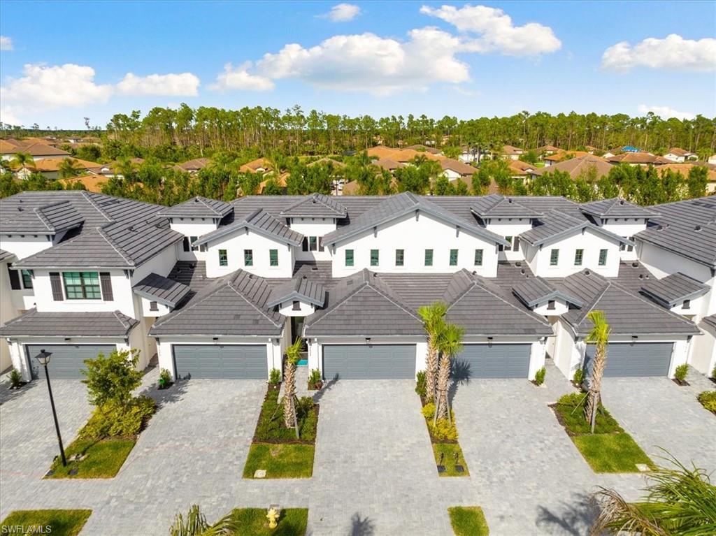 7622 Rockefeller Drive Naples, FL 34119 - Photo 37 of 40 an aerial view of residential houses with outdoor space and ocean view
