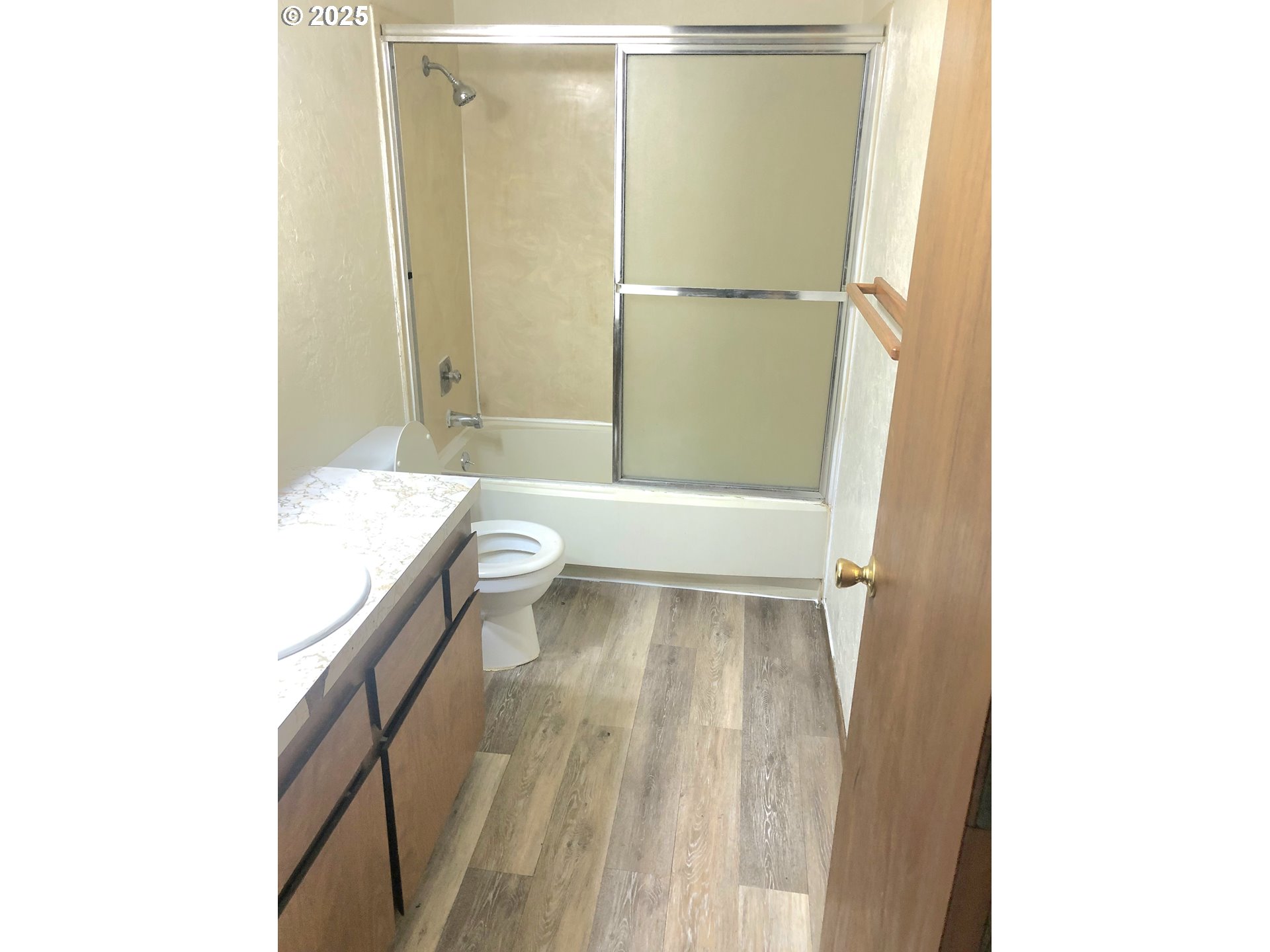 5495 South A Street Springfield, OR 97478 - Photo 8 of 10 a bathroom with a sink a toilet and shower