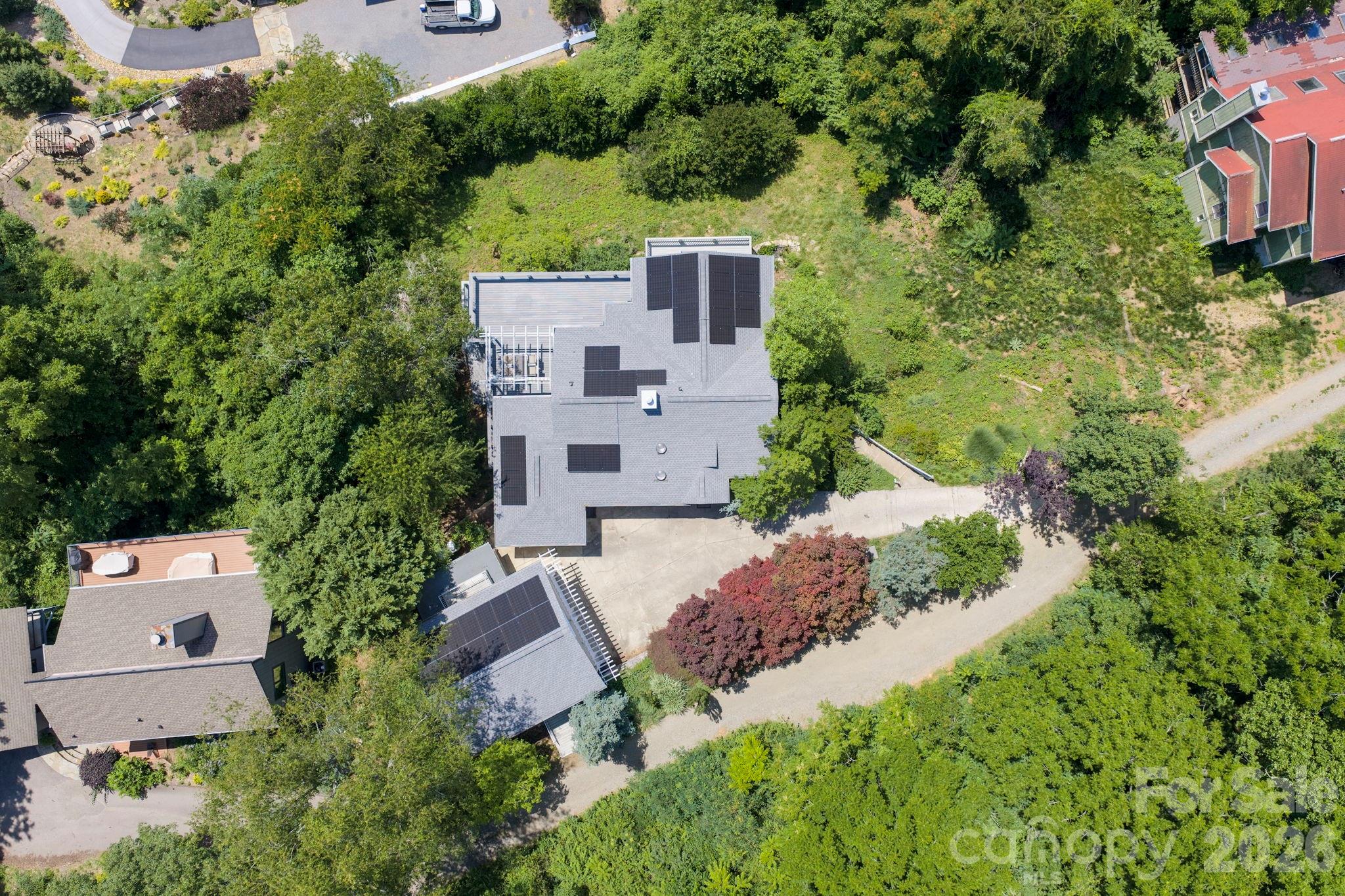 38 Lookout Road Asheville, NC 28804 - Photo 32 of 34 an aerial view of a house with a yard and trees all around
