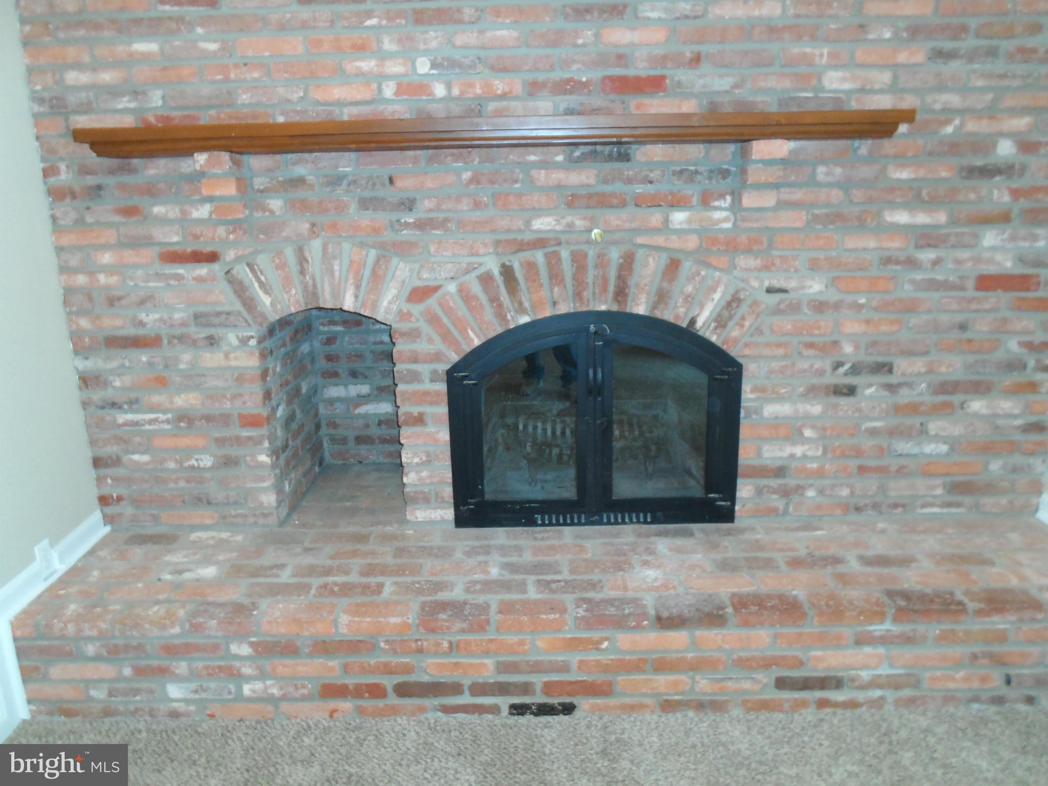 313 Soapstone Lane Silver Spring, MD 20905 - Photo 9 of 30 Brick Fireplace