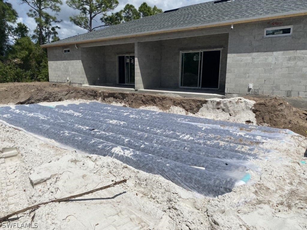 833-835 Meadow Road Lehigh Acres, FL 33973 - Photo 3 of 6 a view of a house with a yard