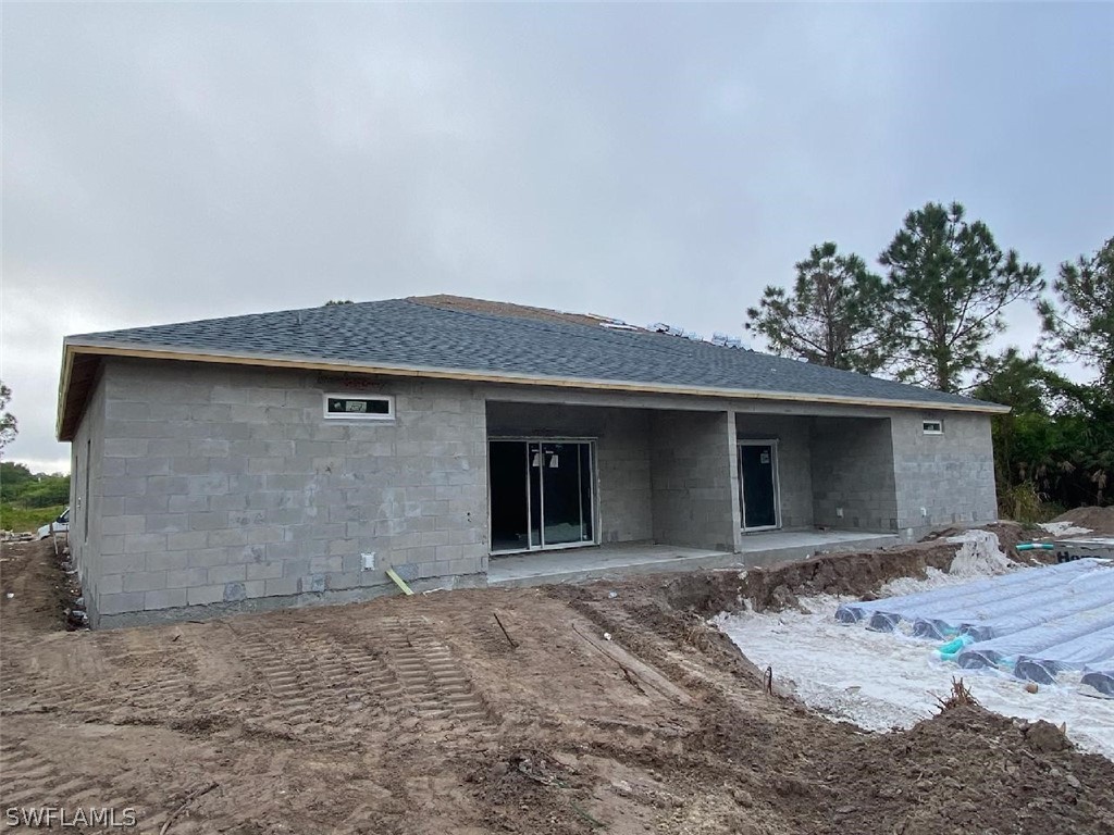 833-835 Meadow Road Lehigh Acres, FL 33973 - Photo 6 of 6 a view of a house with a yard