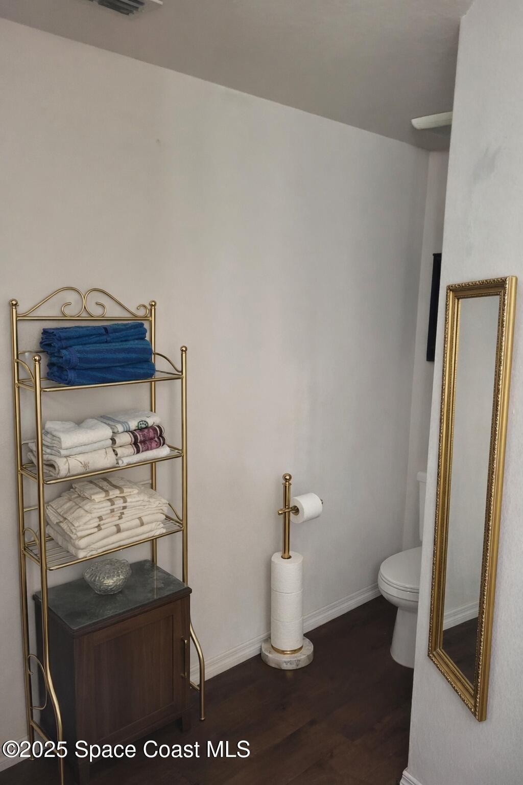 645 Chicago Way Dundee, FL 33838 - Photo 16 of 25 a bathroom with a sink and a toilet