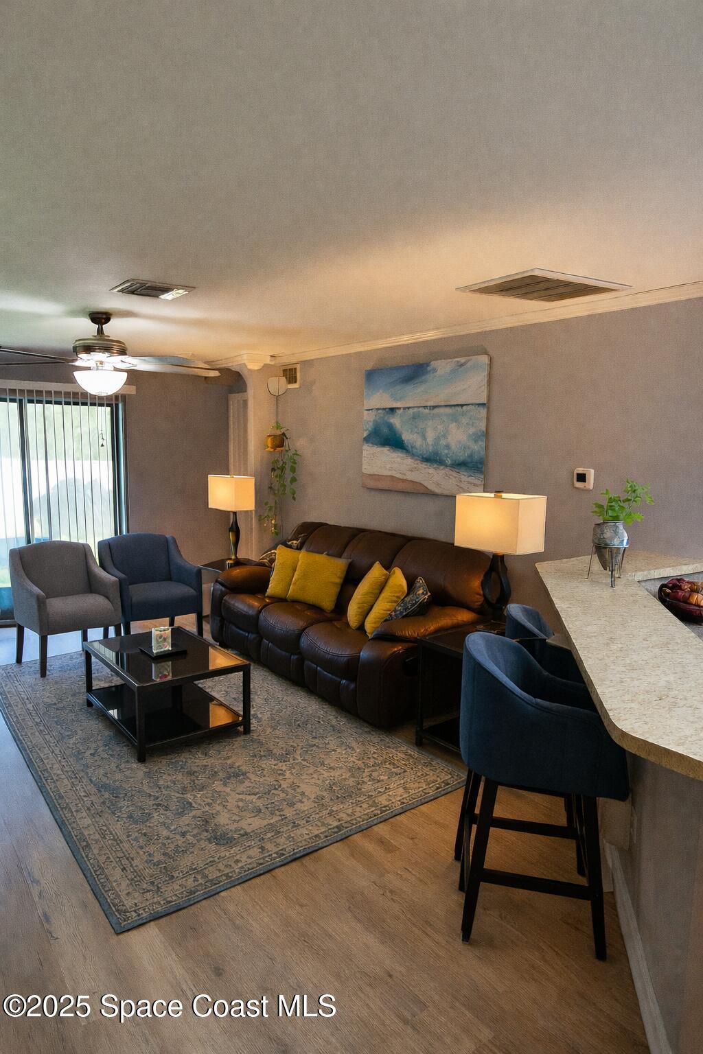 645 Chicago Way Dundee, FL 33838 - Photo 4 of 25 a living room with furniture and a rug