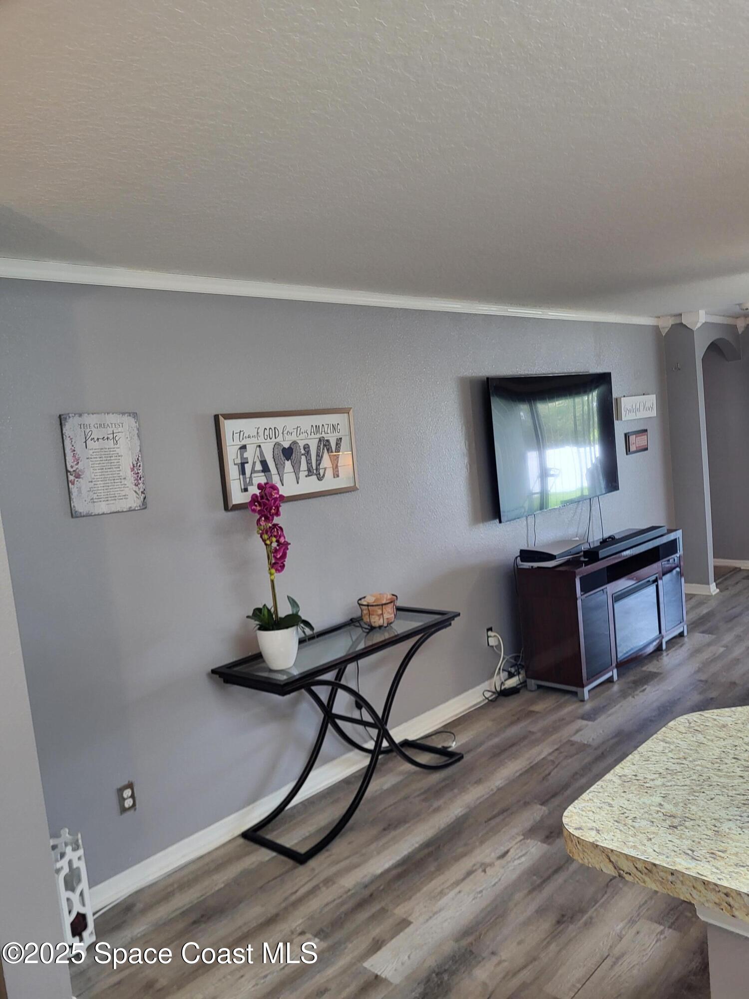 645 Chicago Way Dundee, FL 33838 - Photo 5 of 25 a living room with furniture and a wooden floor