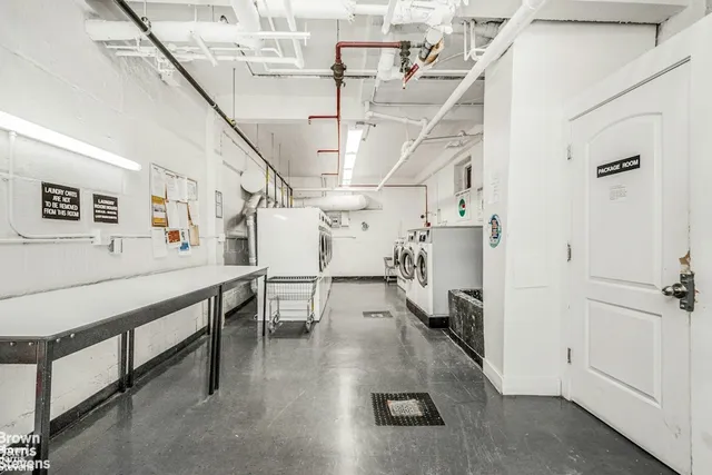 a bathroom with a bathtub sink and mirror