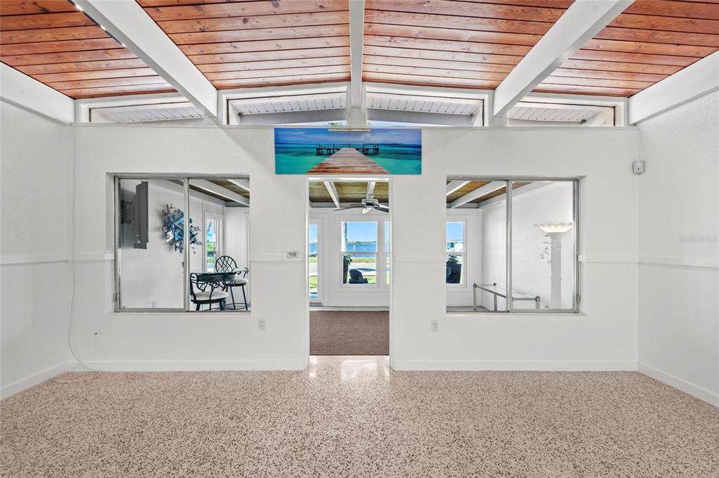 2014 Riverside Drive East Bradenton, FL 34208 - Photo 17 of 66 an entryway view with wooden floor and a ceiling fan