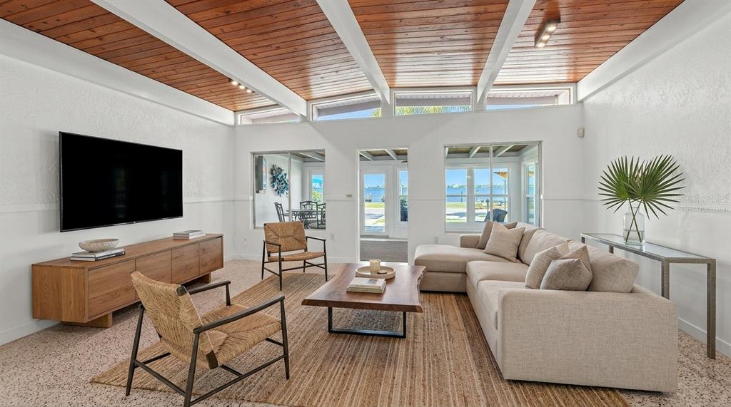 2014 Riverside Drive East Bradenton, FL 34208 - Photo 19 of 66 a living room with furniture and a flat screen tv