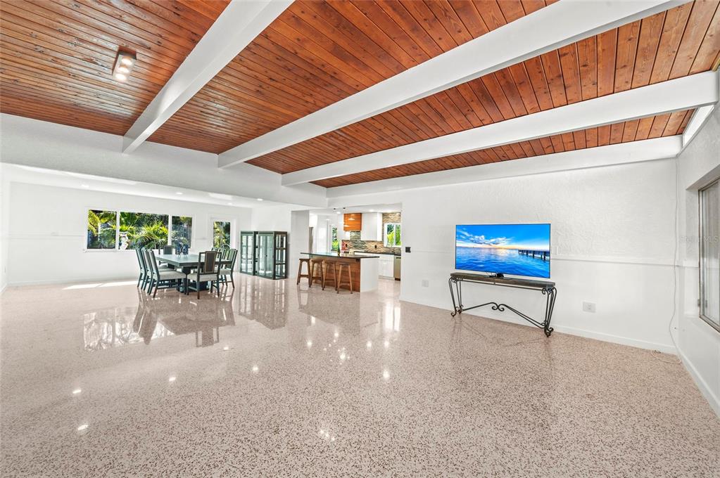 2014 Riverside Drive East Bradenton, FL 34208 - Photo 20 of 66 a dining room with furniture and a floor to ceiling window
