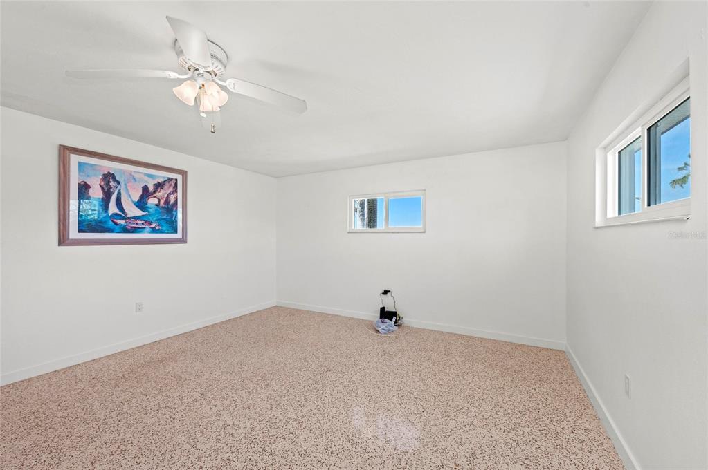 2014 Riverside Drive East Bradenton, FL 34208 - Photo 38 of 66 a view of a bedroom with a painting on the wall