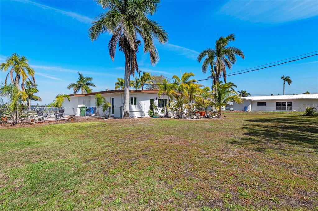 2014 Riverside Drive East Bradenton, FL 34208 - Photo 49 of 66 a front view of a house with a garden