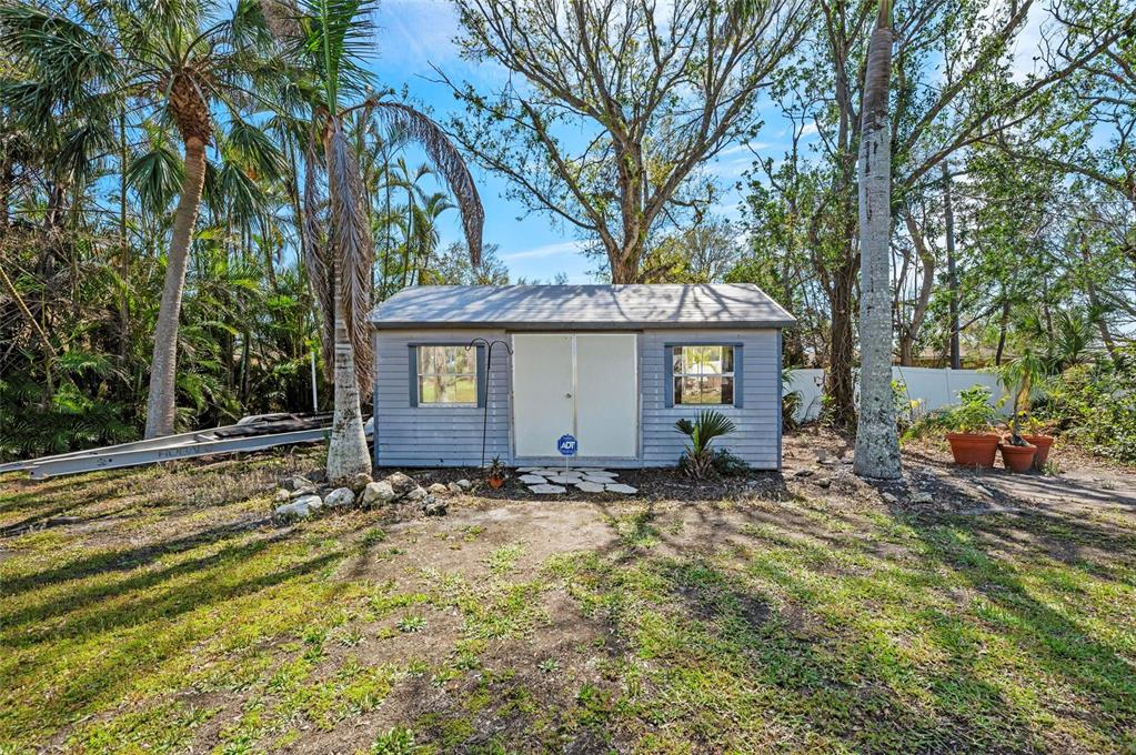 2014 Riverside Drive East Bradenton, FL 34208 - Photo 50 of 66 a view of a house with a tree in the background