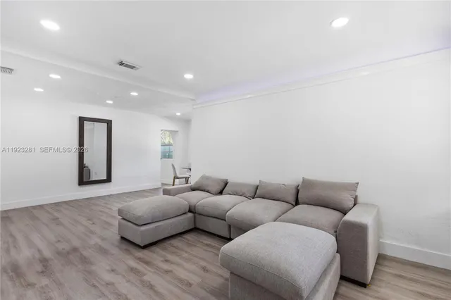 a living room with furniture and a couch