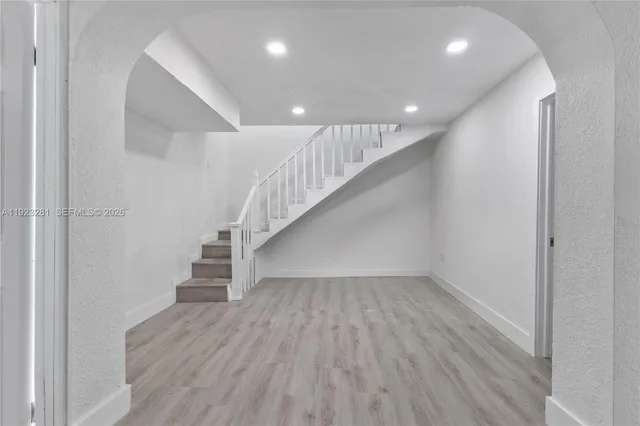 a view of entryway with wooden floor
