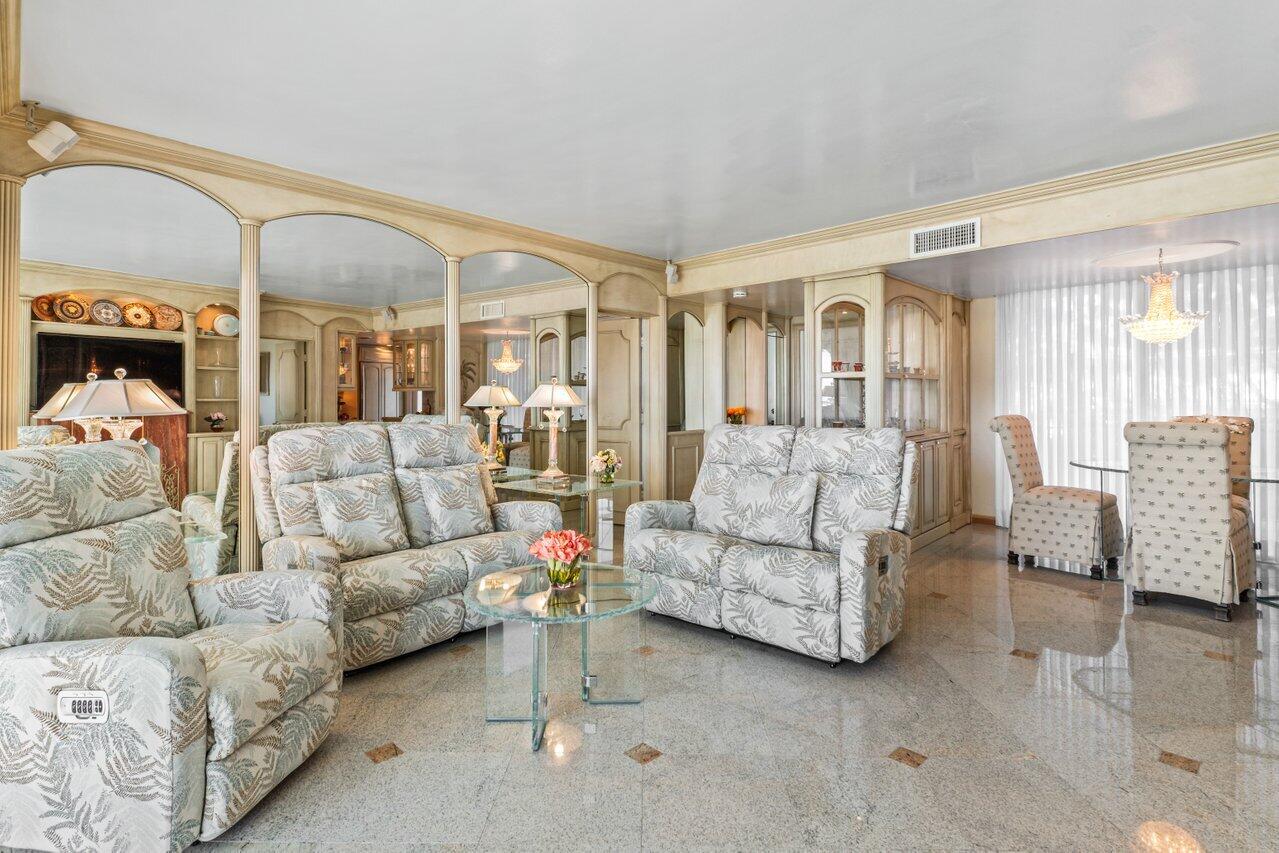 1213 South Ocean Boulevard, Unit 2B Delray Beach, FL 33483 - Photo 12 of 43 a living room with furniture and a large window