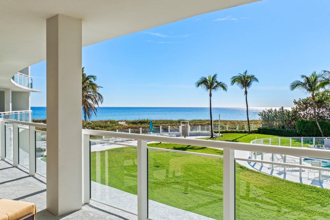 1213 South Ocean Boulevard, Unit 2B Delray Beach, FL 33483 - Photo 19 of 43 a view of a swimming pool with an outdoor seating
