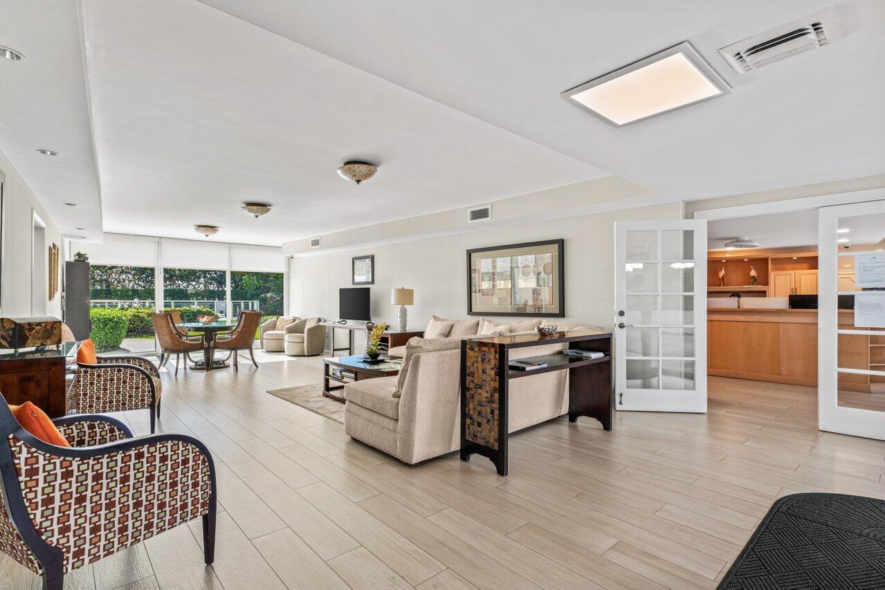 1213 South Ocean Boulevard, Unit 2B Delray Beach, FL 33483 - Photo 29 of 43 a living room with furniture and a large window