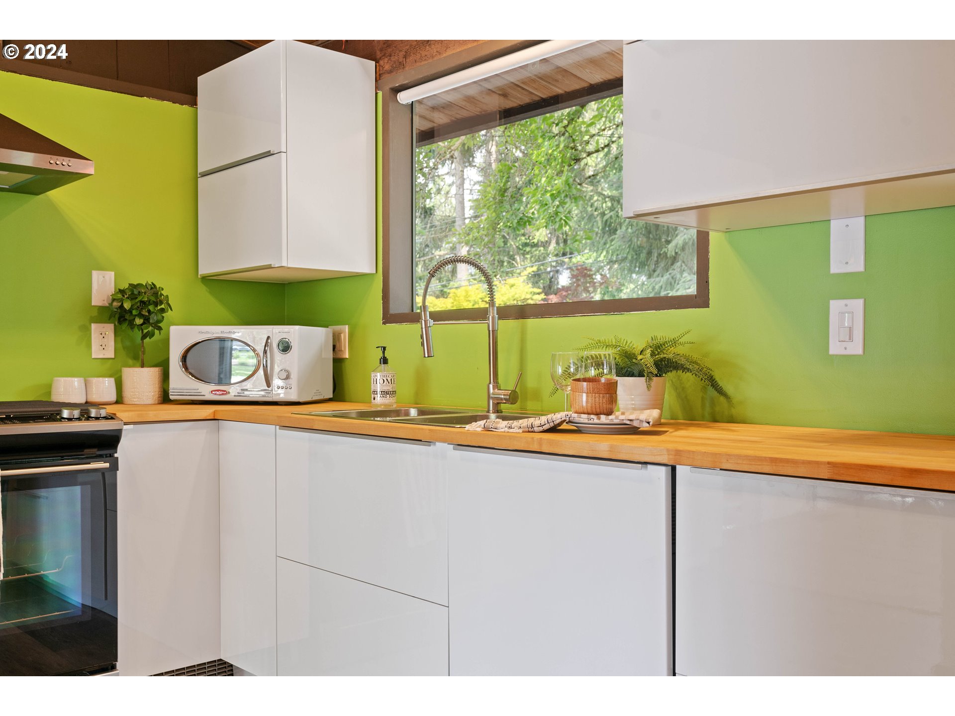 12325 Southwest Park Way Portland, OR 97225 - Photo 11 of 40 a kitchen with a sink and a large window
