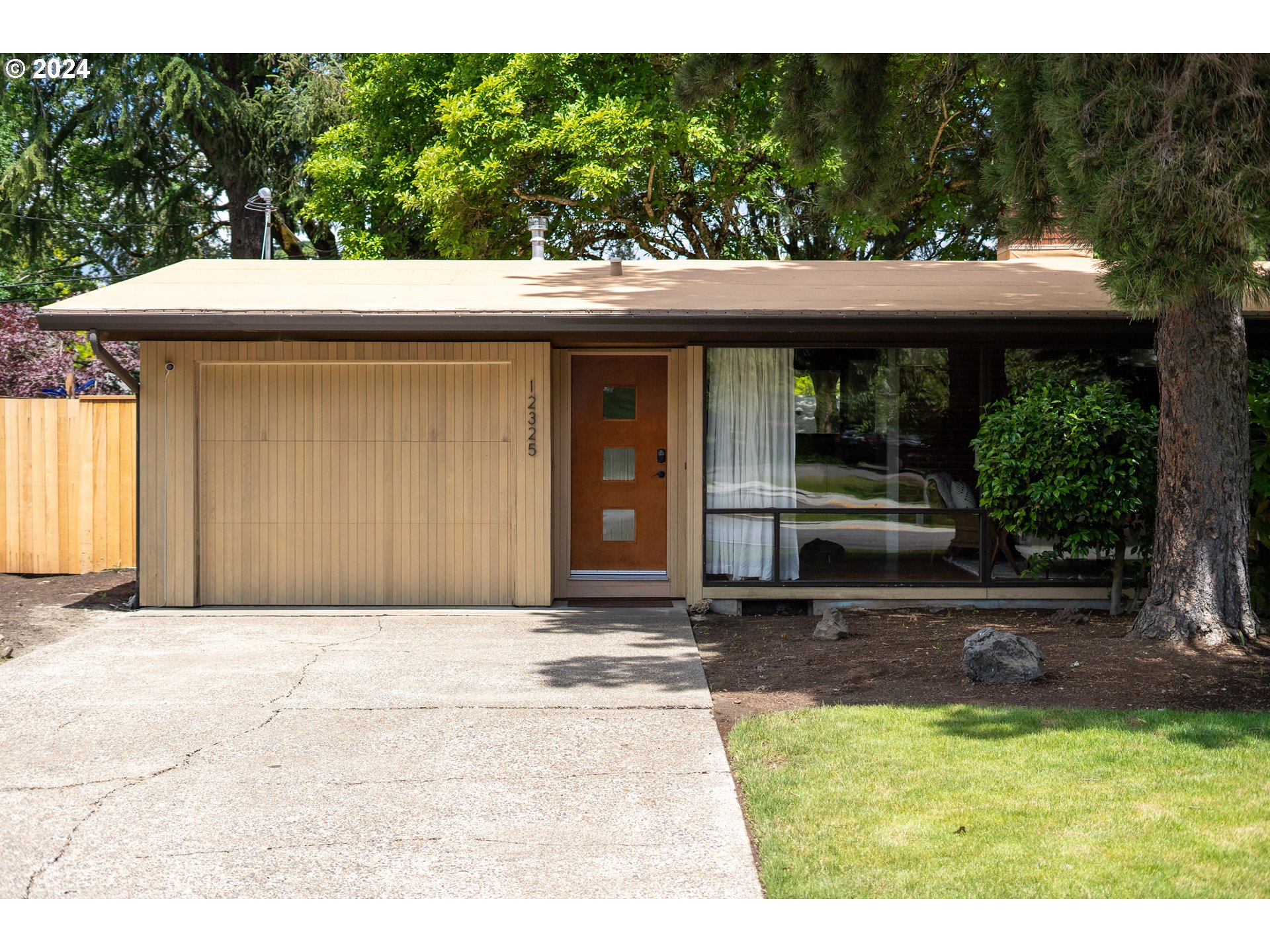 12325 Southwest Park Way Portland, OR 97225 - Photo 2 of 40 a front view of a house with garden
