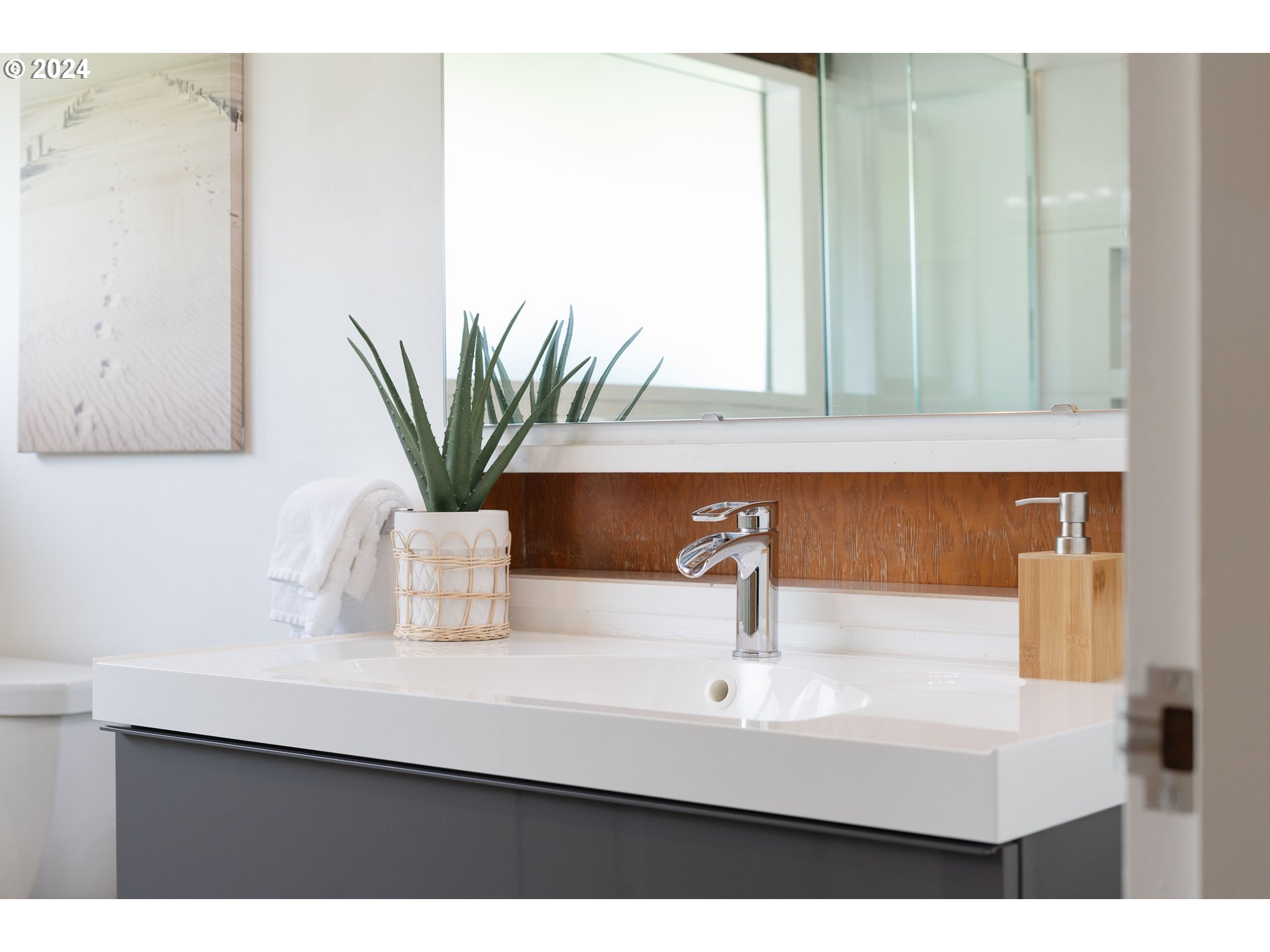 12325 Southwest Park Way Portland, OR 97225 - Photo 24 of 40 a bathroom with a sink a mirror and a potted plant