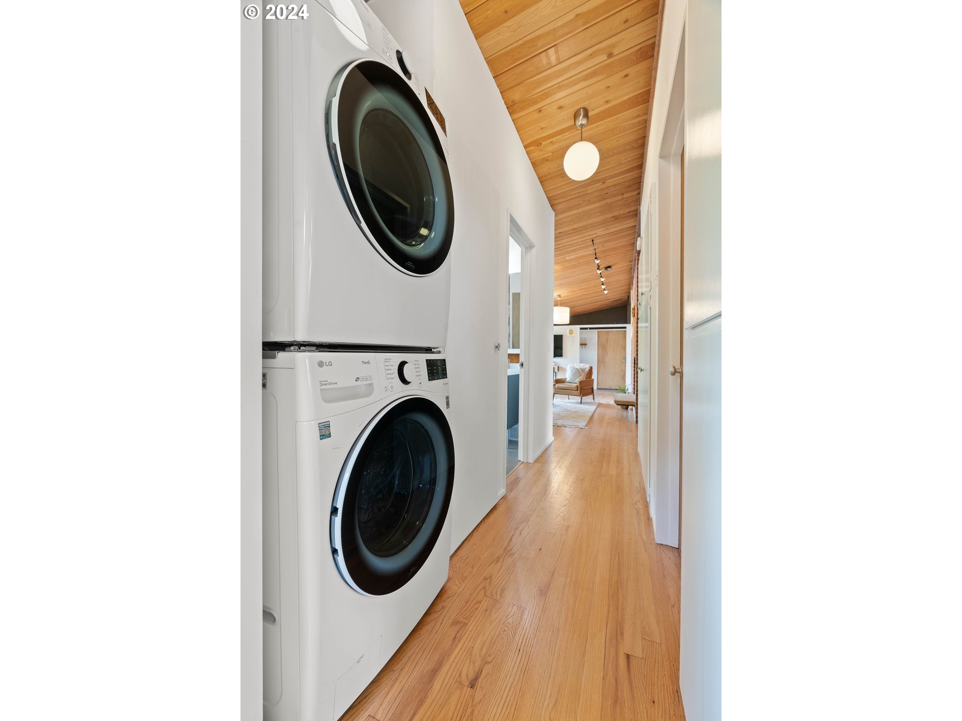 12325 Southwest Park Way Portland, OR 97225 - Photo 27 of 40 a view of a hallway with washer and dryer