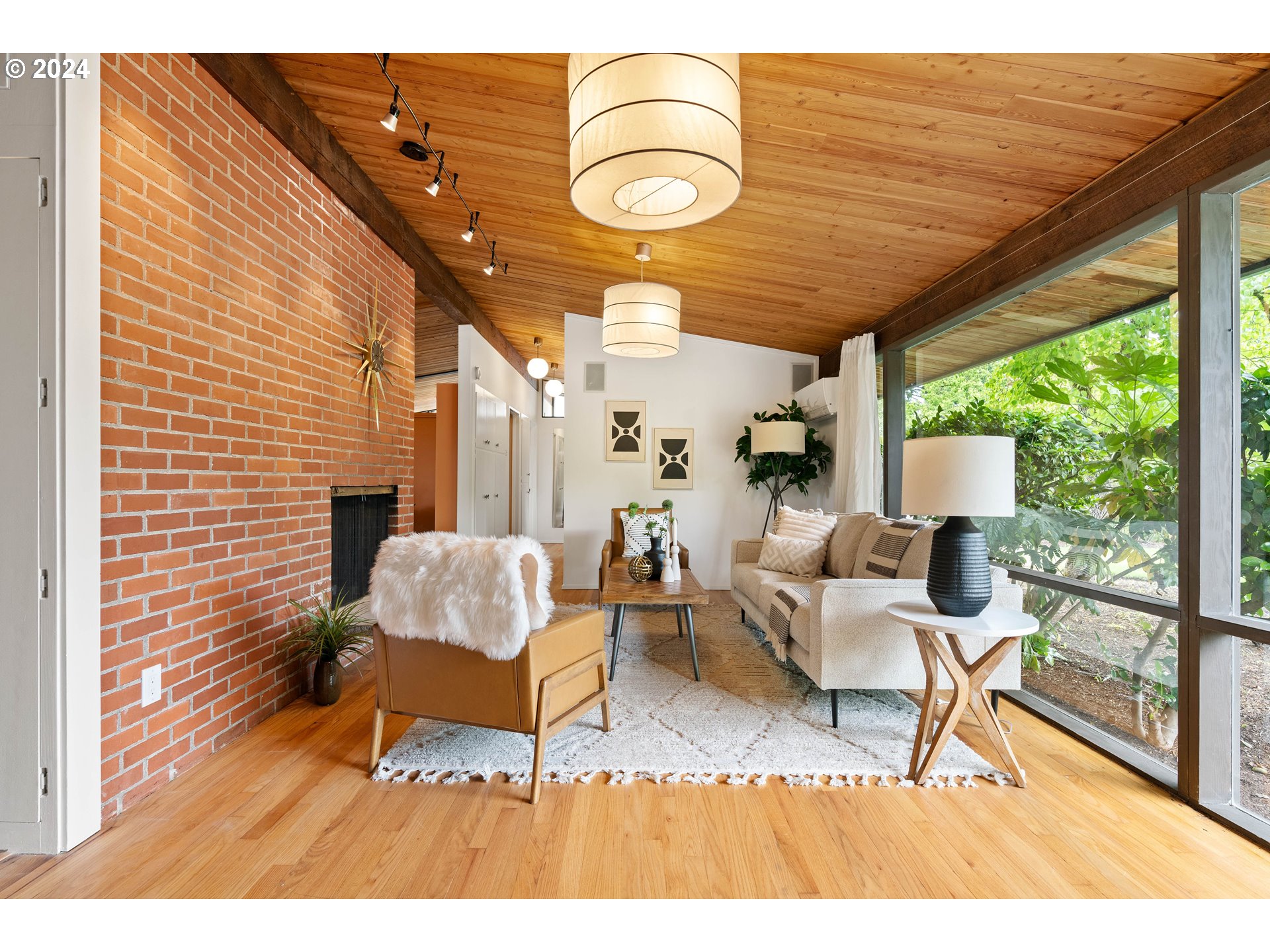 12325 Southwest Park Way Portland, OR 97225 - Photo 3 of 40 a living room with furniture and a floor to ceiling window