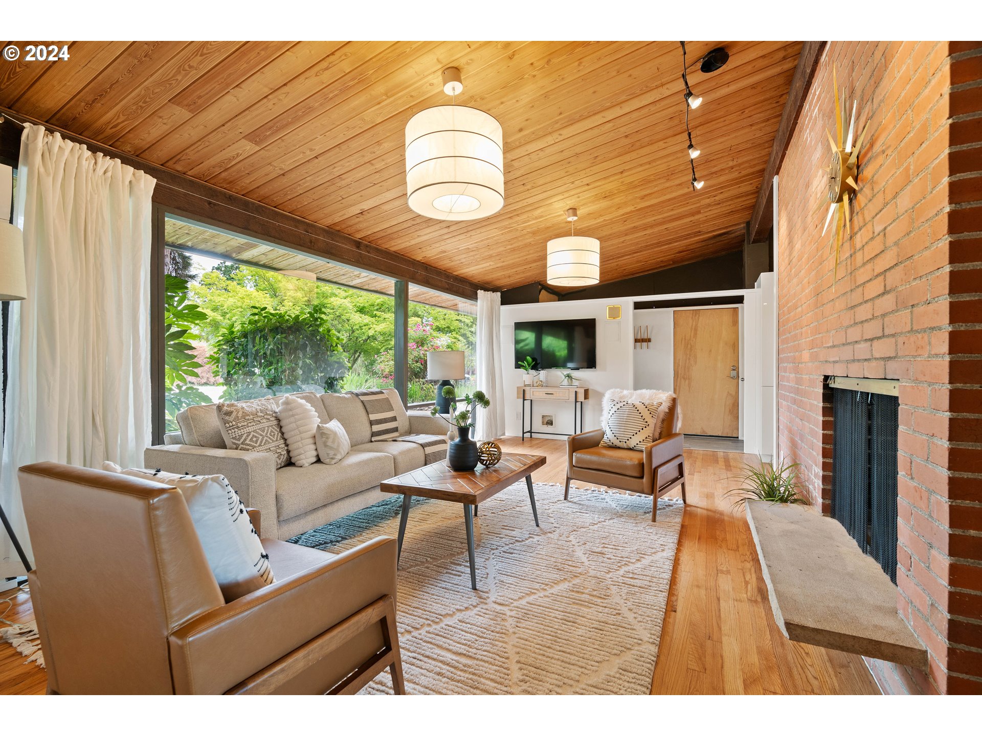 12325 Southwest Park Way Portland, OR 97225 - Photo 5 of 40 a living room with furniture a fireplace and a large window