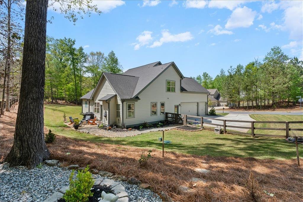 7610 Scenic Overlook Cumming, GA 30041 - Photo 42 of 62 a view of a house with backyard and sitting area