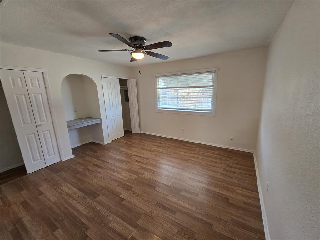 3304 Crestforest Circle Plano, TX 75074 - Photo 13 of 14 a view of empty room with wooden floor and fan
