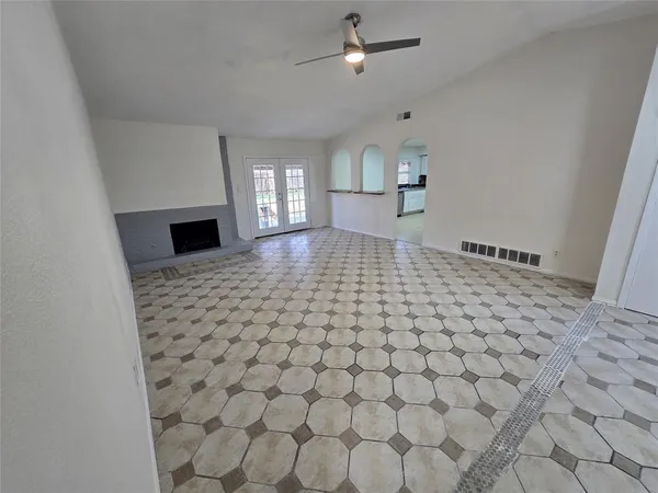 a living room with a couch and a rug