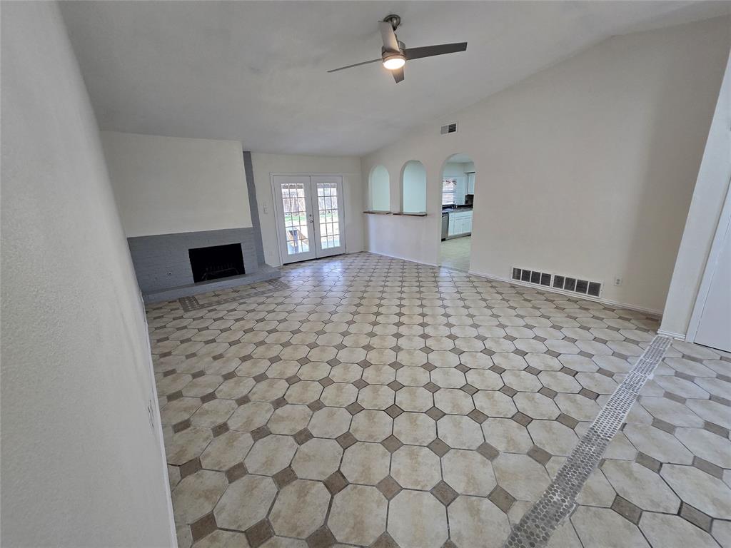 3304 Crestforest Circle Plano, TX 75074 - Photo 4 of 14 a living room with a couch and a rug