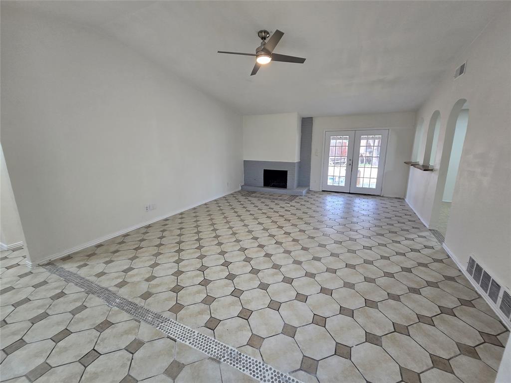 3304 Crestforest Circle Plano, TX 75074 - Photo 6 of 14 wooden floor in an empty room with a window