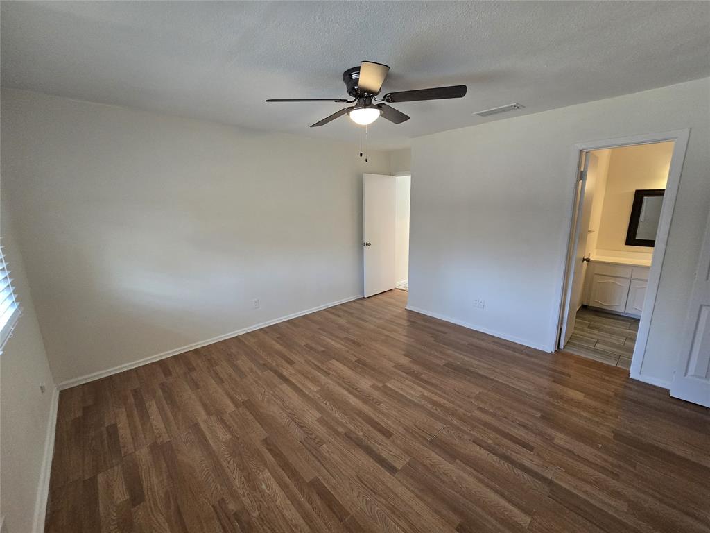 3304 Crestforest Circle Plano, TX 75074 - Photo 10 of 14 a view of empty room with wooden floor