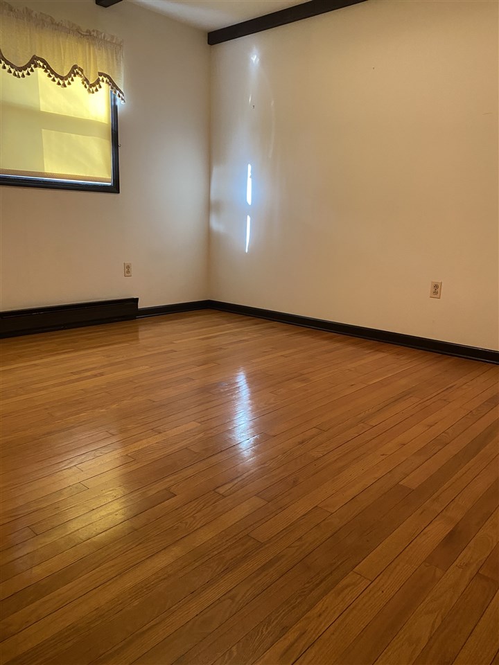 1770 Shutterlee Mill Road Staunton, VA 24401 - Photo 24 of 38 an empty room with wooden floor and windows