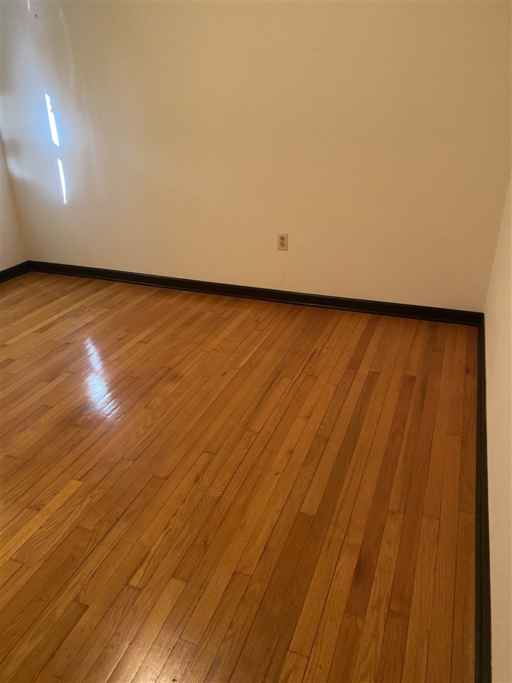 1770 Shutterlee Mill Road Staunton, VA 24401 - Photo 25 of 38 a view of an empty room with wooden floor and a window