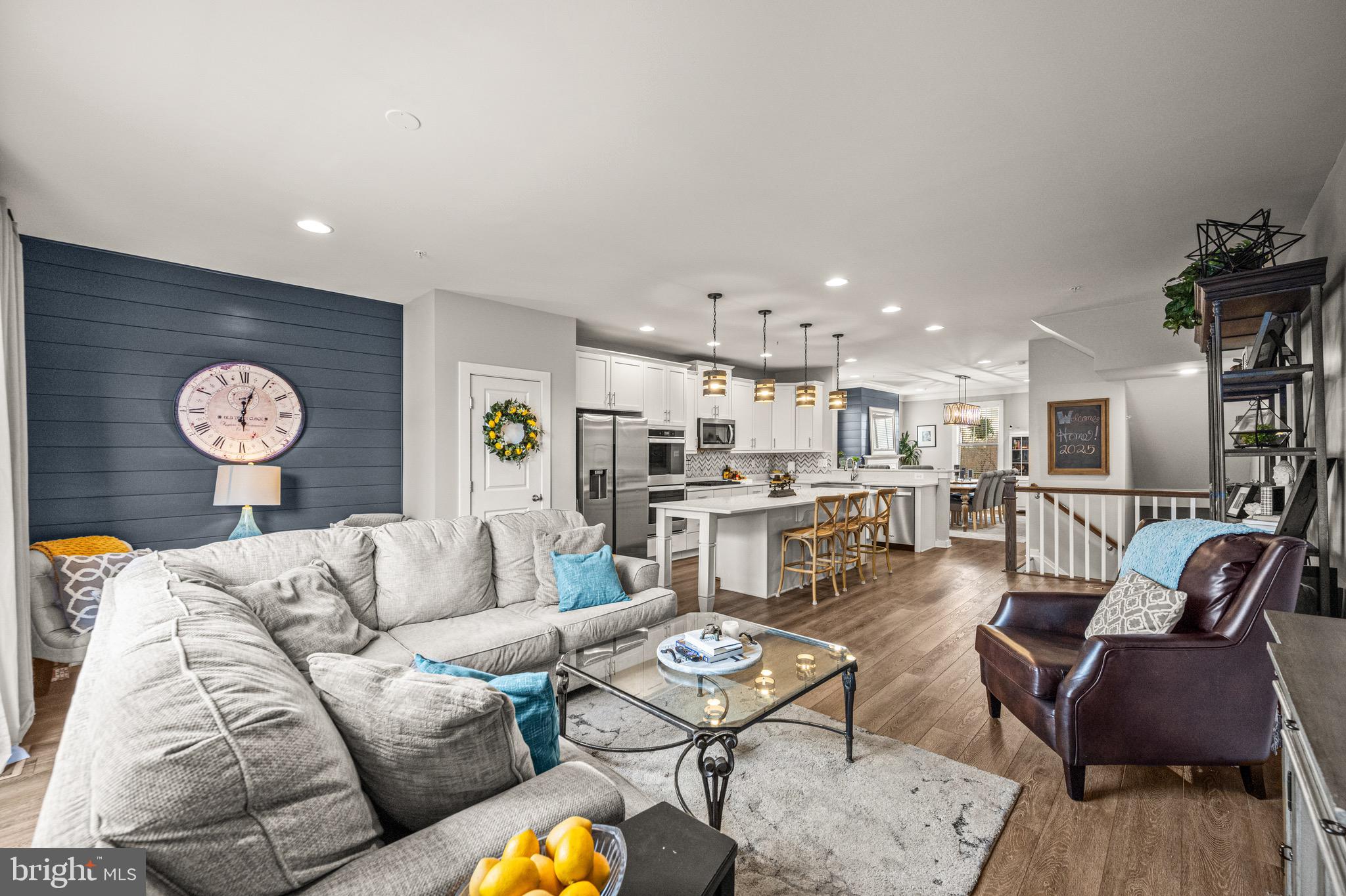 3313 Stone Barn Drive Frederick, MD 21704 - Photo 15 of 47 a living room with furniture kitchen view and a table