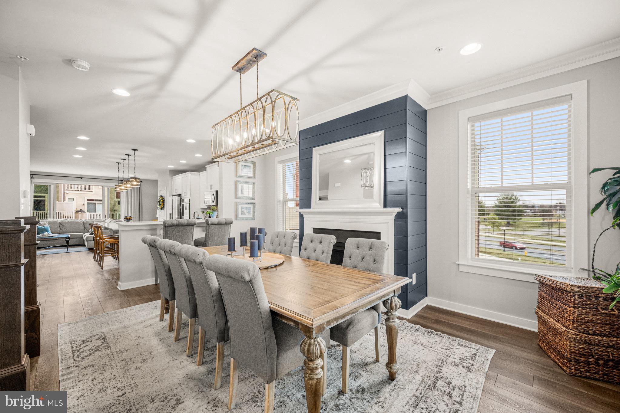 3313 Stone Barn Drive Frederick, MD 21704 - Photo 16 of 47 a dining room with furniture a rug and a chandelier