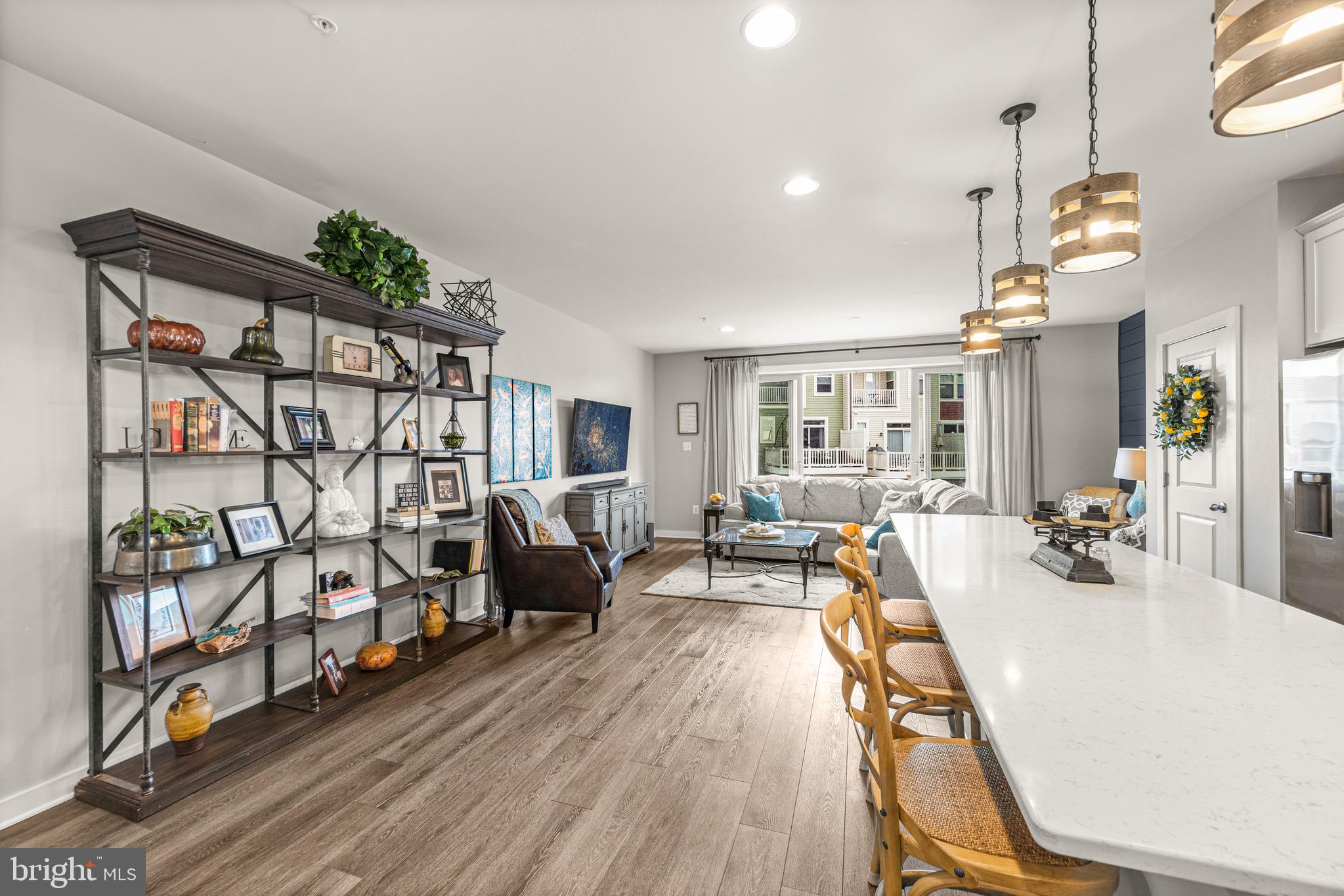 3313 Stone Barn Drive Frederick, MD 21704 - Photo 10 of 47 a view of a livingroom with furniture and hardwood floor