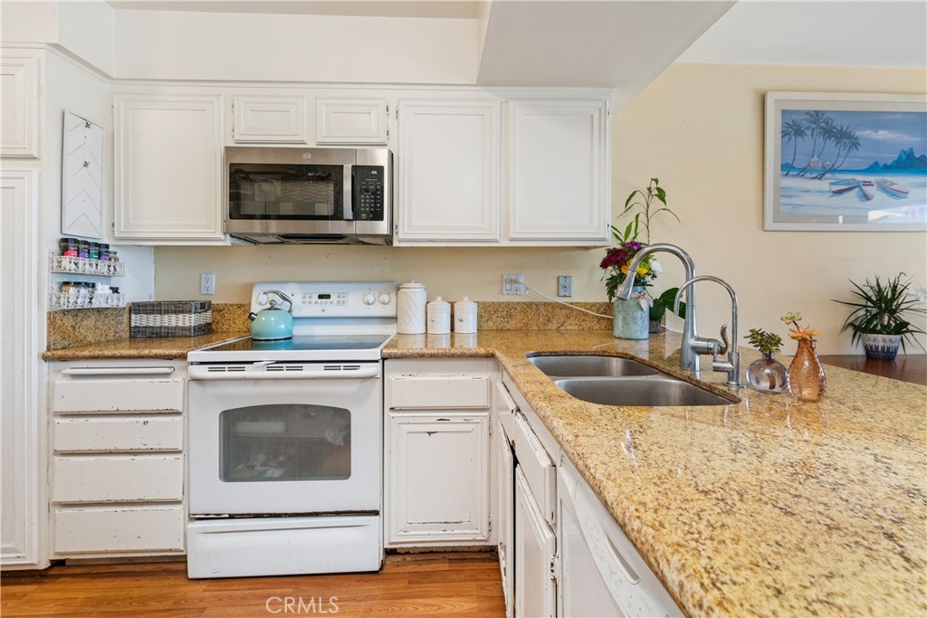 567 Avenida Adobe San Clemente, CA 92672 - Photo 13 of 33 a kitchen with sink a microwave and stove