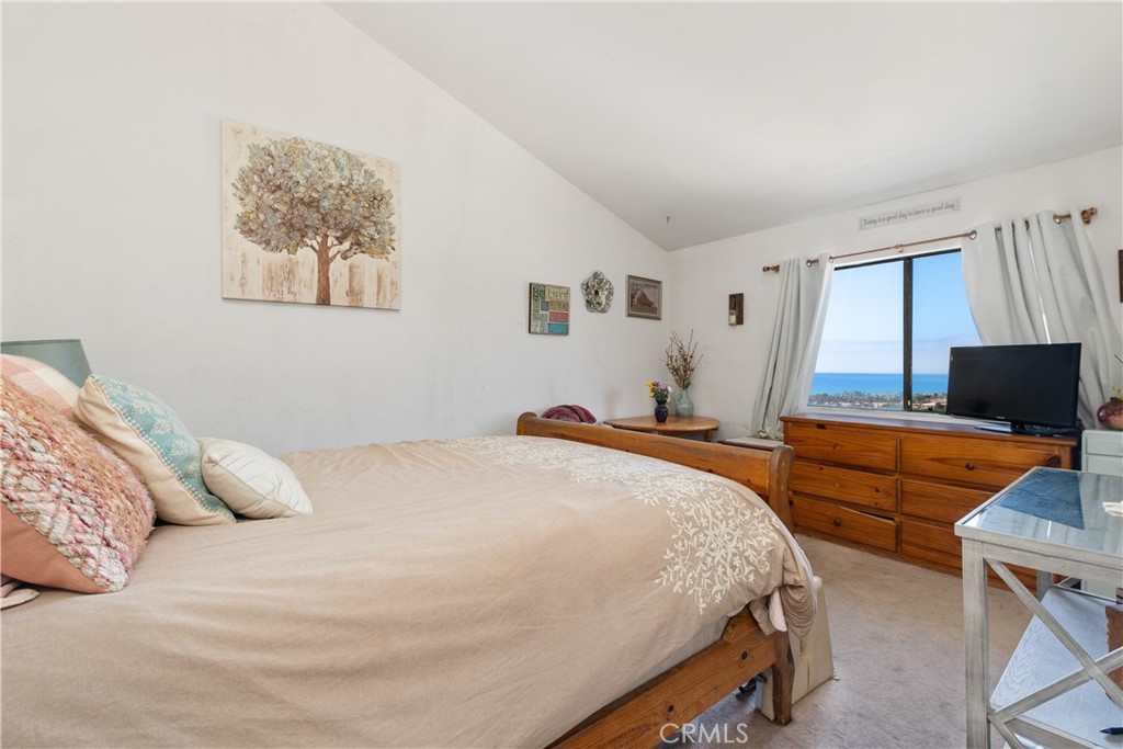 567 Avenida Adobe San Clemente, CA 92672 - Photo 19 of 33 a bedroom with a bed and a flat screen tv