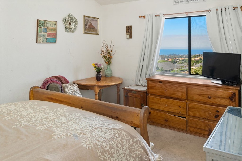 567 Avenida Adobe San Clemente, CA 92672 - Photo 20 of 33 a bedroom with a bed and window