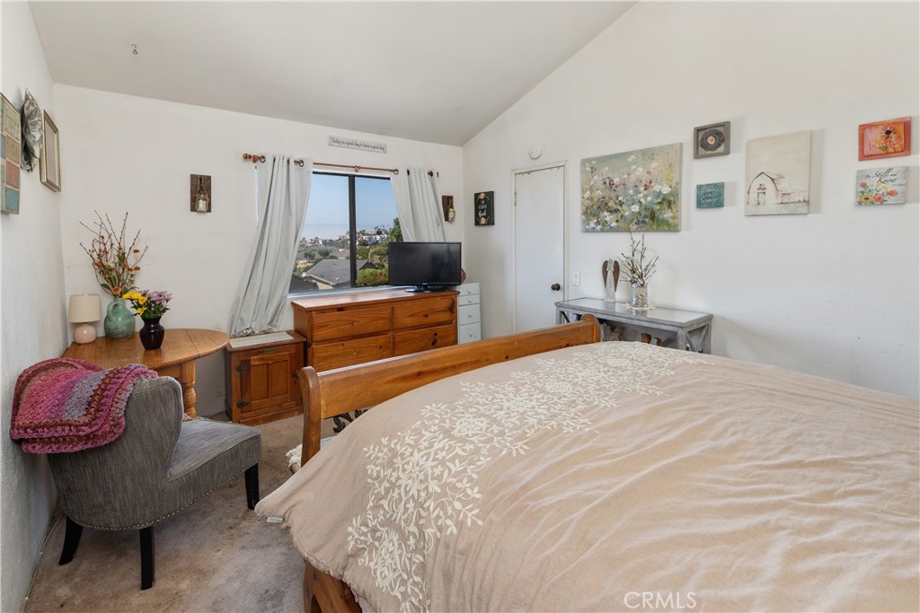 567 Avenida Adobe San Clemente, CA 92672 - Photo 21 of 33 a bedroom with furniture and a wooden floor