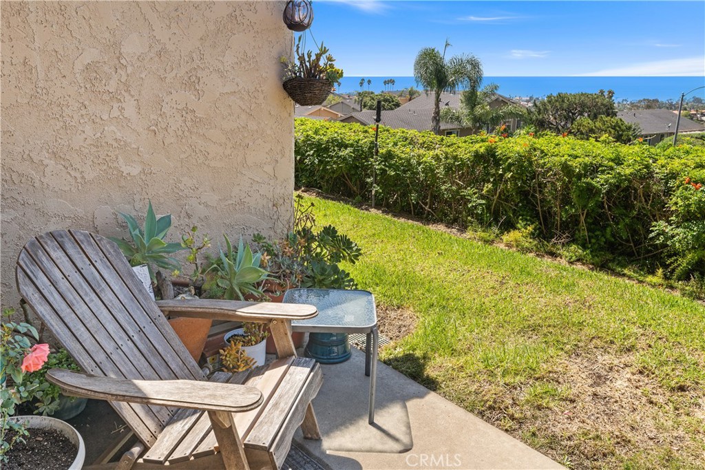567 Avenida Adobe San Clemente, CA 92672 - Photo 26 of 33 a patio with table and chairs and potted plants