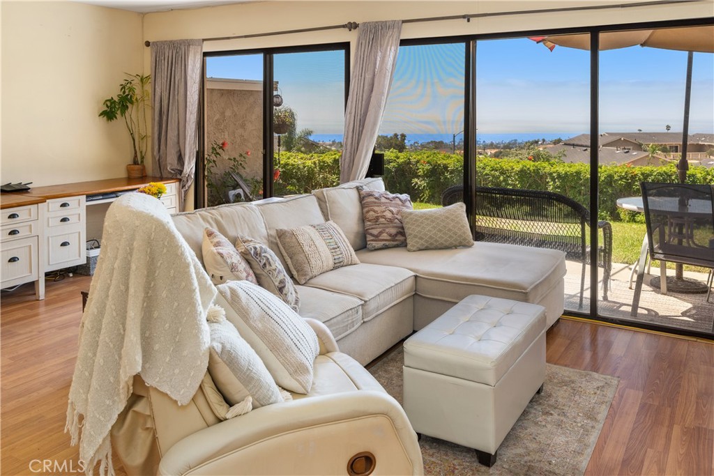 567 Avenida Adobe San Clemente, CA 92672 - Photo 7 of 33 a living room with furniture and a large window