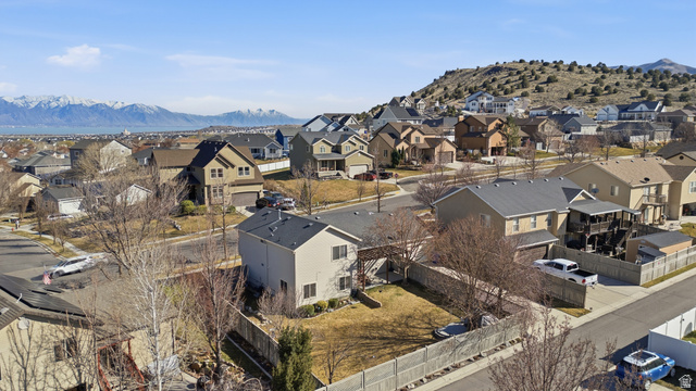 7737 Ranches Parkway Eagle Mountain, UT 84005 - Photo 27 of 28 Aerial perspective showcasing a residential neighborhood with varied architectural styles