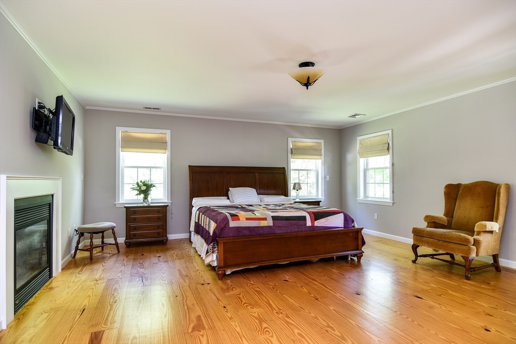 33 Grove Street Framingham, MA 01701 - Photo 19 of 33 a bedroom with a bed and a couch