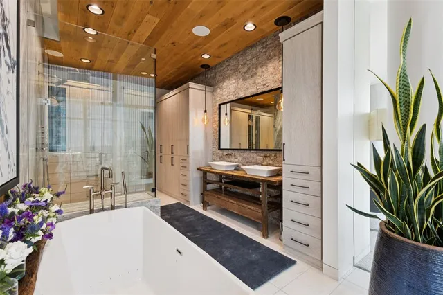 a spacious bathroom with a double vanity sink and a mirror