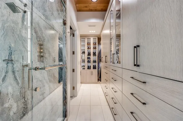 a bathroom with a double vanity sink and mirror