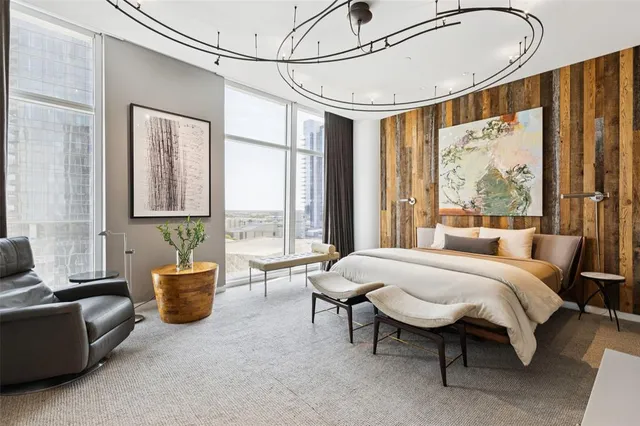 a bedroom with furniture and a window